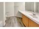 Clean bathroom with wood-look floor, single sink vanity, and toilet at 170 Rolling Fields Ct, Henderson, NV 89012