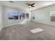 Spacious bedroom with ceiling fan, carpet, and multiple windows at 170 Rolling Fields Ct, Henderson, NV 89012