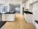 Modern kitchen featuring island, white cabinets, and granite countertops at 170 Rolling Fields Ct, Henderson, NV 89012