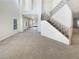 Spacious living room with high ceilings and elegant staircase at 170 Rolling Fields Ct, Henderson, NV 89012
