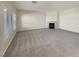 Spacious living room featuring a fireplace and large windows at 170 Rolling Fields Ct, Henderson, NV 89012