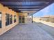 Covered patio with pergola, brick pavers, and access to backyard at 170 Rolling Fields Ct, Henderson, NV 89012
