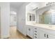 Spa-like bathroom with double sinks, large mirror, and a walk-in shower at 185 Rocky Star St, Henderson, NV 89012