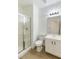 Clean bathroom with a toilet, vanity, and a shower stall at 185 Rocky Star St, Henderson, NV 89012