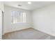 Bright bedroom with carpet flooring and large window at 185 Rocky Star St, Henderson, NV 89012