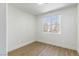 Spacious bedroom with large window and wood-look flooring at 185 Rocky Star St, Henderson, NV 89012