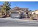 Two-story house with stone accents and a two-car garage at 185 Rocky Star St, Henderson, NV 89012