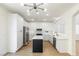 Modern kitchen with white cabinets, quartz countertops, and a center island at 185 Rocky Star St, Henderson, NV 89012