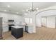 Modern kitchen with white cabinets, center island and open to the Gathering room at 185 Rocky Star St, Henderson, NV 89012