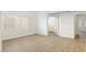 Bright living room with hardwood floors and access to other rooms at 185 Rocky Star St, Henderson, NV 89012