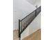 Modern staircase with dark wood railings and light flooring at 185 Rocky Star St, Henderson, NV 89012