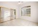 Well-lit bedroom with mirrored closet doors and ceiling fan at 2260 Norway Pine Ct, Las Vegas, NV 89134