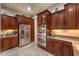 Spacious kitchen with stainless steel appliances and ample wood cabinetry at 2336 Indigo Island St, Henderson, NV 89044