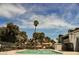 Inviting community pool with palm trees and surrounding patio at 2462 Paradise Village Way, Las Vegas, NV 89120