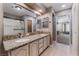 Double sink bathroom with granite countertop and shower at 2653 Starfish Ct, Las Vegas, NV 89128