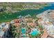 Lake Las Vegas condos overlooking the lake with lush green spaces and pools at 30 Strada Di Villaggio # 115, Henderson, NV 89011