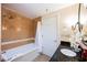 Bathroom with tub, shower, vanity, and dark countertop at 30 Strada Di Villaggio # 115, Henderson, NV 89011