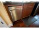 Stainless steel dishwasher with wood cabinets at 30 Strada Di Villaggio # 115, Henderson, NV 89011