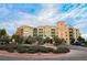 Elegant building exterior with manicured landscaping and a convenient circular driveway for easy access at 30 Strada Di Villaggio # 115, Henderson, NV 89011