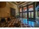 Luxurious lobby with high ceilings, ornate chandelier, and elegant tile flooring with a view to the outside at 30 Strada Di Villaggio # 115, Henderson, NV 89011
