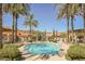 Lake Las Vegas condo community featuring a stunning pool with lush palms at 30 Strada Di Villaggio # 115, Henderson, NV 89011