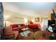 Studio apartment with red couch, bed, and dining table at 30 Strada Di Villaggio # 115, Henderson, NV 89011