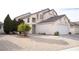 Two-story house with a landscaped yard and attached garage at 3425 Trilogy Dr, Las Vegas, NV 89108