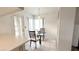 Cozy breakfast nook in the kitchen with glass table at 3425 Trilogy Dr, Las Vegas, NV 89108