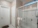 Clean bathroom with a large shower and double doors at 3556 Valley Lily St, North Las Vegas, NV 89032