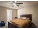 Spacious bedroom with a king-size bed and ceiling fan at 3556 Valley Lily St, North Las Vegas, NV 89032