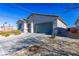 Front view of the house with a paved driveway at 3556 Valley Lily St, North Las Vegas, NV 89032