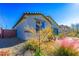 Side yard view of the home showcasing landscaping at 3556 Valley Lily St, North Las Vegas, NV 89032