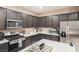 Modern kitchen with stainless steel appliances at 3556 Valley Lily St, North Las Vegas, NV 89032