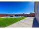 Relaxing kidney-shaped pool and patio area at 3556 Valley Lily St, North Las Vegas, NV 89032