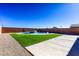 Backyard oasis featuring a kidney-shaped pool at 3556 Valley Lily St, North Las Vegas, NV 89032