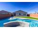 Beautiful pool with water feature in backyard at 3556 Valley Lily St, North Las Vegas, NV 89032