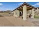 Covered patio, grassy area, and block wall at 372 Cooper Hawk Ct, Las Vegas, NV 89138