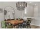 Elegant dining area with a live-edge wood table and modern chairs at 372 Cooper Hawk Ct, Las Vegas, NV 89138