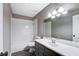 Clean bathroom with white tub and gray vanity at 3971 Foxboro Cir, Las Vegas, NV 89121