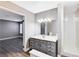 Updated bathroom with gray vanity, new fixtures and shower at 3971 Foxboro Cir, Las Vegas, NV 89121