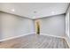 Spacious bedroom with wood-look floors and neutral walls at 3971 Foxboro Cir, Las Vegas, NV 89121
