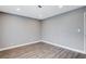 Spacious bedroom with neutral walls and wood-look floors at 3971 Foxboro Cir, Las Vegas, NV 89121
