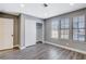 Bedroom with wood-look floors, closet, and windows at 3971 Foxboro Cir, Las Vegas, NV 89121