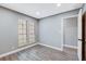 Bright bedroom with wood-look floors and neutral walls at 3971 Foxboro Cir, Las Vegas, NV 89121