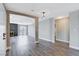 Modern entryway with wood-look floors and views to living room at 3971 Foxboro Cir, Las Vegas, NV 89121