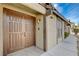 Front entry with double wood doors and walkway at 3971 Foxboro Cir, Las Vegas, NV 89121