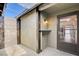 Private entryway with gate and exterior door at 3971 Foxboro Cir, Las Vegas, NV 89121