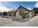 House exterior showcasing a light-tan color scheme, garage, and landscaping at 3971 Foxboro Cir, Las Vegas, NV 89121