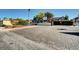 Gated entrance to Forest Hills community with paved road and landscaping at 3971 Foxboro Cir, Las Vegas, NV 89121