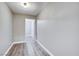 Bright hallway with wood-look floors and neutral walls at 3971 Foxboro Cir, Las Vegas, NV 89121